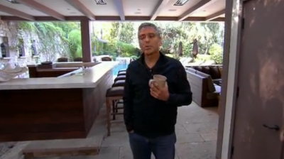 http://www.newsbeast.gr/files/1/2012/02/15/georges-outdoor-bar-and-pool-behind-him.jpg.png