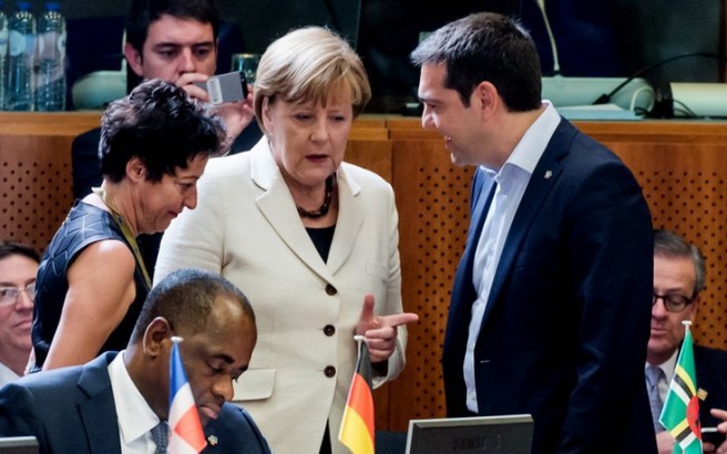 Greek Prime Minister Alexis Tsipras, second right, speaks with German Chancellor Angela Merkel during a round table meeting at the EU-CELAC summit in Brussels on Wednesday, June 10, 2015. Greece's prime minister was hoping to meet with the leaders of Germany and France in Brussels Wednesday, in the latest effort to break a bailout negotiation deadlock that has revived fears his country could default and drop out of the euro. (AP Photo/Geert Vanden Wijngaert)