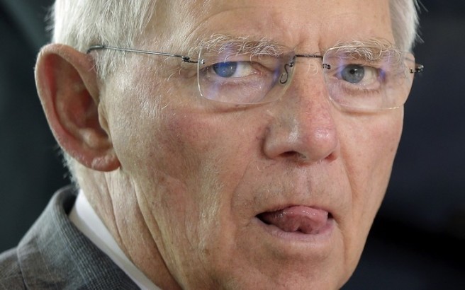 German Finance Minister Wolfgang Schaeuble arrives for the weekly cabinet meeting at the chancellery in Berlin, Germany, Wednesday, June 17, 2015. (AP Photo/Michael Sohn)