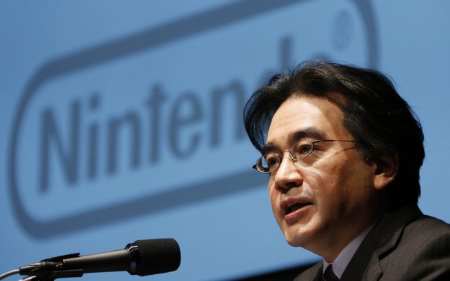 FILE - In this Jan. 31, 2013 file photo, Nintendo Co. President Satoru Iwata speaks during a news conference in Tokyo. Nintendo said President Iwata died Saturday, July 11, 2015, of a bile duct tumor in a Kyoto hospital, western Japan. (AP Photo/Koji Sasahara, File)