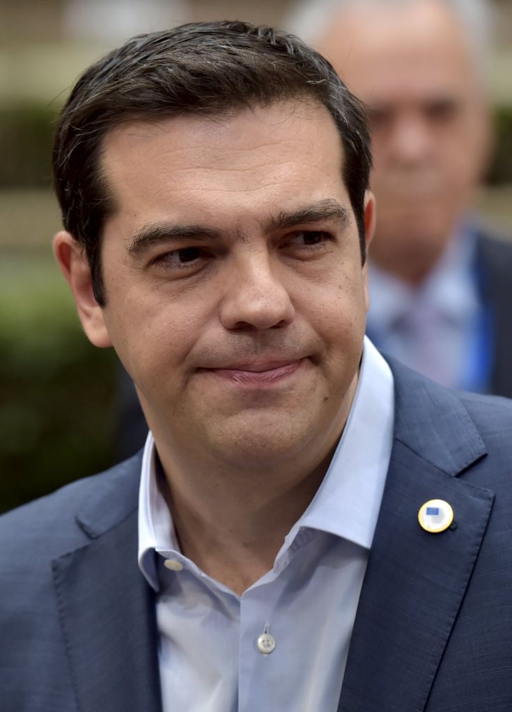 Greece's Prime Minister Alexis Tsipras talks to the media as he arrives at a euro zone leaders summit in Brussels, Belgium, July 12, 2015. Euro zone leaders will fight to the finish to keep near-bankrupt Greece in the single currency on Sunday after the European Union's chairman canceled a planned summit of all 28 EU leaders that would have been needed in case of a "Grexit". REUTERS/Eric Vidal