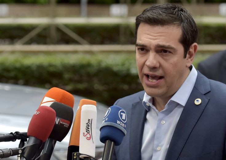 Greece's Prime Minister Alexis Tsipras talks to the media as he arrives at a euro zone leaders summit in Brussels, Belgium, July 12, 2015. Euro zone leaders will fight to the finish to keep near-bankrupt Greece in the single currency on Sunday after the European Union's chairman canceled a planned summit of all 28 EU leaders that would have been needed in case of a "Grexit". REUTERS/Eric Vidal