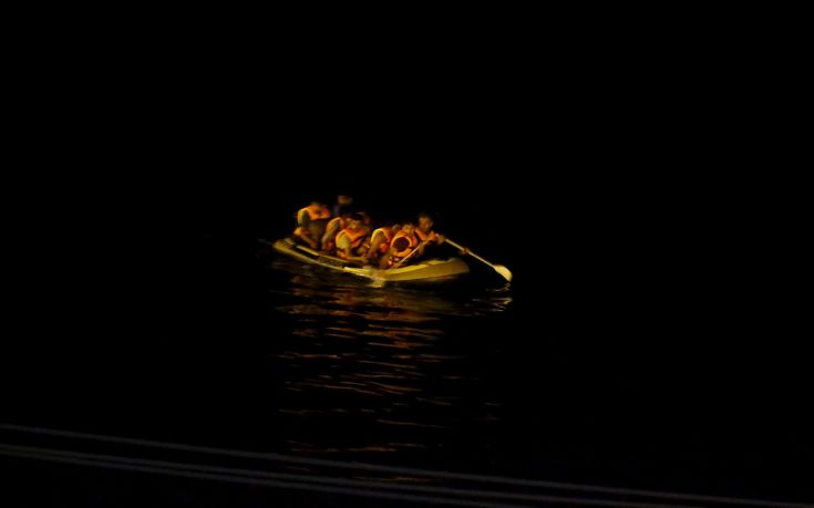 Migrants aboard a dinghy sail off for the Greek island of Kos from the southern Turkish coastal town of Bodrum