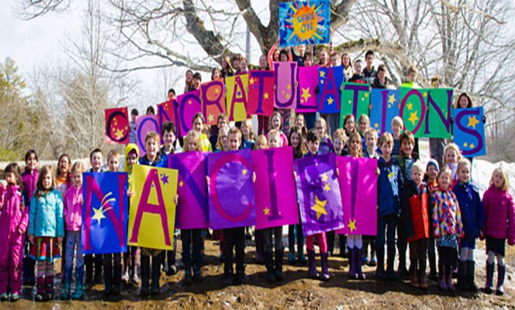 NOT TO ARCHIVE NOT TO ARCHIVE NOT TO ARCHIVE_Center for Teaching and Learning students proudly hold up homemade signs Monday, March 16 congratulating school founder Nancie Atwell for winning the Global Teacher Prize. (Photo courtesy Center for Teaching and Learning)