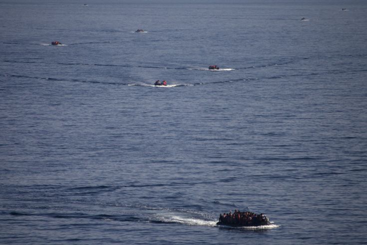 Refugees and migrants are seen onboard eight dinghies as they cross a part of the Aegean Sea from the Turkish coast to reach the Greek island of Lesbos, October 4, 2015. Refugee and migrant arrivals to Greece this year will soon reach 400,000, according to the UN Refugee Agency (UNHCR). REUTERS/Dimitris Michalakis