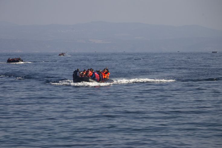 Refugees and migrants are seen onboard eight dinghies as they cross a part of the Aegean Sea from the Turkish coast to reach the Greek island of Lesbos, October 4, 2015. Refugee and migrant arrivals to Greece this year will soon reach 400,000, according to the UN Refugee Agency (UNHCR). REUTERS/Dimitris Michalakis