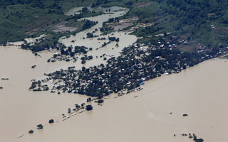 An aerial view of a flooded village in Kalay township at Sagaing division, August 2, 2015. Storms and floods have so far killed 21 people, with water levels as high as 2.5 metres in Sagaing and 4.5 metres in western Rakhine state, according to the government, which on Friday declared four regions disaster zones. REUTERS/Soe Zeya Tun