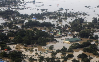 An aerial view of a flooded village in Kalay township at Sagaing division, August 2, 2015. Storms and floods have so far killed 21 people, with water levels as high as 2.5 metres in Sagaing and 4.5 metres in western Rakhine state, according to the government, which on Friday declared four regions disaster zones. REUTERS/Soe Zeya Tun      TPX IMAGES OF THE DAY