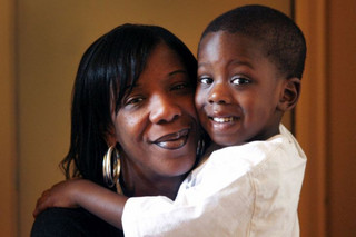 New Jersey, USA. June 3rd 2011.   Marcy Borders with 3yo son Zay-den at their Newark apartment in New Jersey USA. Marcy survived the 2001 September 11 attacks on the World Trade Center buildings in New York City. 10 years on Marcy tells of her memory of the day and the darker years she spent after the event before turning her life around a month ago after some extensive rehabilitation.   Photo Glen McCurtayne/COLEMAN-RAYNER.  For further information contact: Tel US (001) 323 687 8025 - Mobile Tel US (001) 310 474 4343 - Office www.coleman-rayner.com  Coleman-Rayner 030611-GM