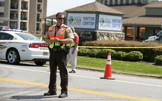A law enforcement officer is seen on the road in front of the Bridgewater Plaza in Moneta