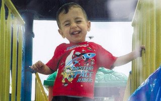 A close up shows Aylan Kurdi in an undated Kurdi family photograph placed outside the home of their aunt Tima Kurdi in Coquitlam, British Columbia