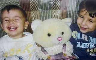 A close up shows Aylan Kurdi and his brother Galip in an undated Kurdi family photograph placed outside the home of their aunt Tima Kurdi in Coquitlam, British Columbia