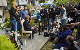Tima Kurdi cries while speaking to the media outside her home in Coquitlam, B.C.