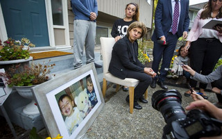 Tima Kurdi cries while speaking to the news media outside her home in Coquitlam, B.C.