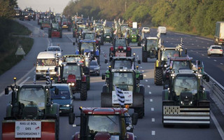 French farmers from western France region drive their tractors on the A10 motorway outside Paris