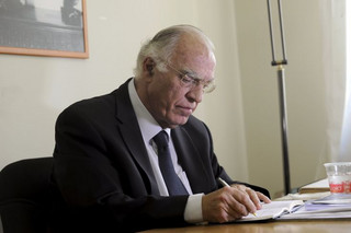 Leader of the Union of Centrists party Vassilis Leventis takes notes before an interview with Reuters at the party headquarters in Athens, Greece, September 17, 2015. A civil engineer and one-time aspiring musician who claims to have had the foresight to predict Greece's financial crisis 25 years ago is making a dent in mainstream parties' support before national elections. Tapping into frustration at years of economic hardship and broken promises, Vassilis Leventis's Union of Centrists is polling between 3.5 and 4 percent of the electorate, giving it a foothold to win seats in Greece's 300-member parliament in Sunday's vote. REUTERS/Michalis Karagiannis