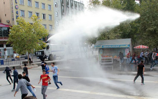 Riot police use a water cannon to disperse demonstrators, during a protest against Saturday's bomb blasts in Ankara, in the Kurdish dominated southeastern city of Diyarbakir