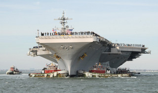 us-navy-111210-n-qy430-003-the-aircraft-carrier-uss-george-h-w-bush-cvn-77-pulls-into-naval-station-norfolk-following-a-seven-month-deployment