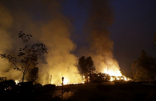 Smoke and flames from fire at the Hilton Sonoma Wine Country hotel in Santa Rosa, Calif., Monday, Oct. 9, 2017. (AP Photo/Jeff Chiu)