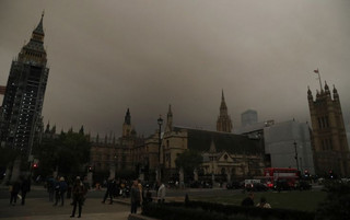 Big Ben and the Houses of Parliament are bathed in a dull orange sky in London, Monday, Oct. 16, 2017. The unusual hue of the sky was thought to be due to the remnants of Hurricane Orphelia dragging in tropical air and dust from the Sahara. (AP Photo/Frank Augstein)