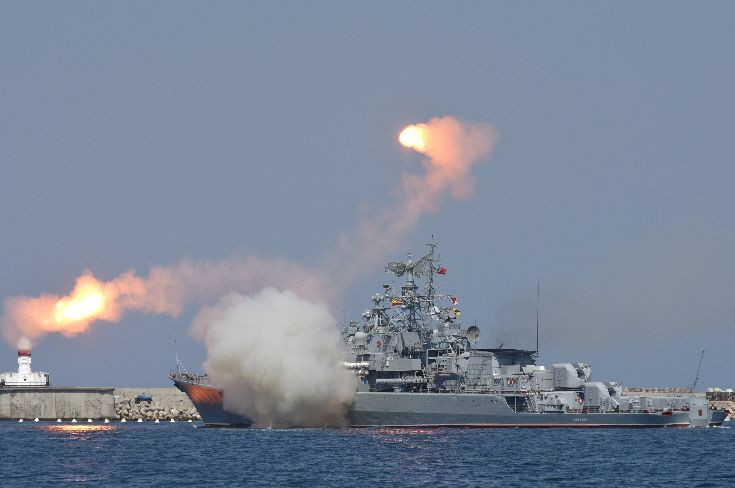A Russian warship fires during celebrations for Navy Day in the Black Sea port of Sevastopol A Russian warship fires during celebrations for Navy Day in the Black Sea port of Sevastopol
