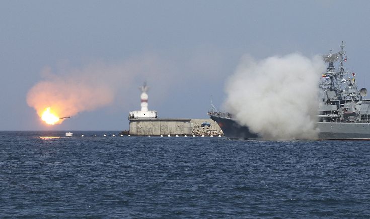 A Russian warship fires during celebrations for Navy Day in Sevastopol A Russian warship fires during celebrations for Navy Day in Sevastopol
