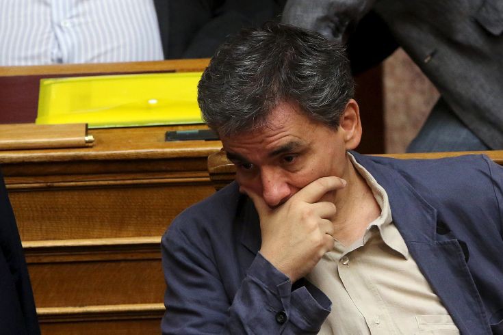 Greek Finance Minister Euclid Tsakalotos reacts during a parliamentary session in Athens, Greece July 15, 2015. A lot of the measures in a deal struck with Greece's lenders will have a recessionary effect but removing the prospect of a "Grexit" will help offset their impact and bring in investments, Tsakalotos said on Wednesday.  REUTERS/Yiannis Kourtoglou