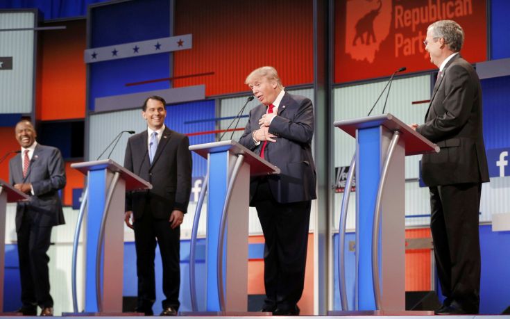 Fellow Republican 2016 U.S. presidential candidates Dr. Ben Carson (L), Wisconsin Governor Scott Walker (2nd L) and former Florida Governor Jeb Bush (R) laugh as fellow candidate and businessman Donald Trump (2nd R) reacts near the end of the debate after realizing that a slew of criticisms spoken by fellow candidate and former Arkansas Governor Mike Huckabee (not pictured) were not aimed at him but at Democratic presidential candidate Hillary Clinton, at the first official Republican presidential candidates debate of the 2016 U.S. presidential campaign in Cleveland, Ohio, August 6, 2015. REUTERS/Brian Snyder Fellow Republican 2016 U.S. presidential candidates Dr. Ben Carson (L), Wisconsin Governor Scott Walker (2nd L) and former Florida Governor Jeb Bush (R) laugh as fellow candidate and businessman Donald Trump (2nd R) reacts near the end of the debate after realizing that a slew of criticisms spoken by fellow candidate and former Arkansas Governor Mike Huckabee (not pictured) were not aimed at him but at Democratic presidential candidate Hillary Clinton, at the first official Republican presidential candidates debate of the 2016 U.S. presidential campaign in Cleveland, Ohio, August 6, 2015. REUTERS/Brian Snyder
