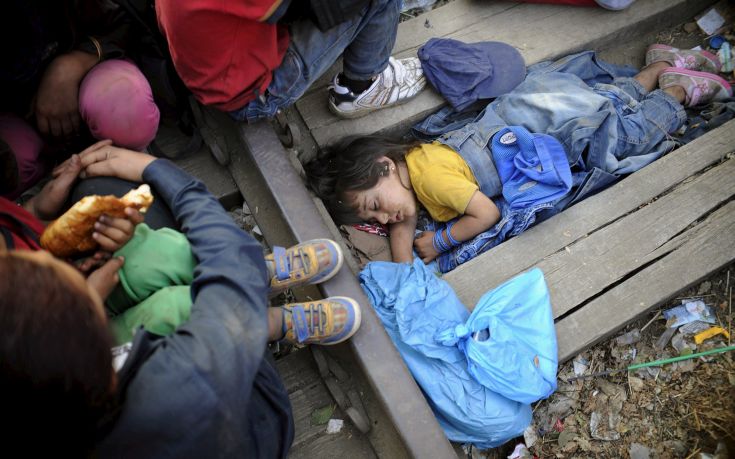 Rashida, part of a new group of immigrants, sleeps as they wait at border line of Macedonia and Greece to enter into Macedonia near Gevgelija railway station Rashida, part of a new group of immigrants, sleeps as they wait at border line of Macedonia and Greece to enter into Macedonia near Gevgelija railway station