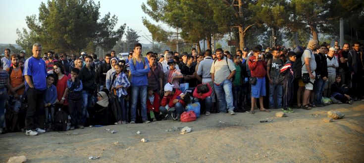 A new group of more than a thousand immigrants wait at the border line of Macedonia and Greece to enter into Macedonia A new group of more than a thousand immigrants wait at the border line of Macedonia and Greece to enter into Macedonia