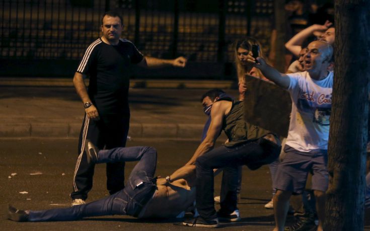 Lebanese protesters help a wounded man during a protest against corruption and rubbish collection problems near the government palace in Beirut Lebanese protesters help a wounded man during a protest against corruption and rubbish collection problems near the government palace in Beirut