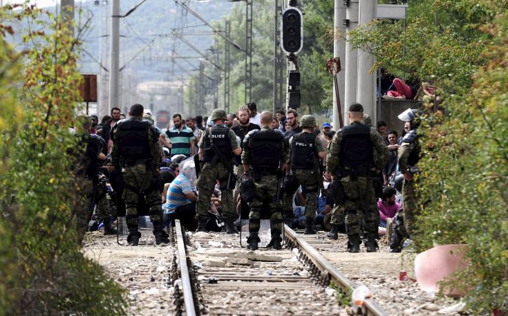 Macedonian special policemen guard the border as more than a thousand immigrants wait at the border line of Macedonia and Greece to enter Macedonia near the Gevgelija railway station August 21, 2015. Macedonian police drove back crowds of migrants and refugees trying to enter from Greece on Friday after a night spent stranded in no-man's land by an emergency decree effectively sealing the Macedonian frontier. REUTERS/Ognen Teofilovski Macedonian special policemen guard the border as more than a thousand immigrants wait at the border line of Macedonia and Greece to enter Macedonia near the Gevgelija railway station August 21, 2015. Macedonian police drove back crowds of migrants and refugees trying to enter from Greece on Friday after a night spent stranded in no-man's land by an emergency decree effectively sealing the Macedonian frontier. REUTERS/Ognen Teofilovski