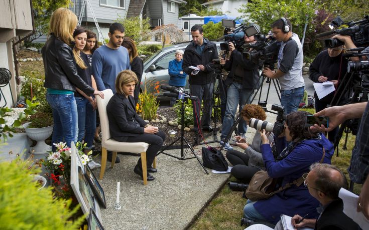 Tima Kurdi cries while speaking to the media outside her home in Coquitlam, B.C. Tima Kurdi cries while speaking to the media outside her home in Coquitlam, B.C.