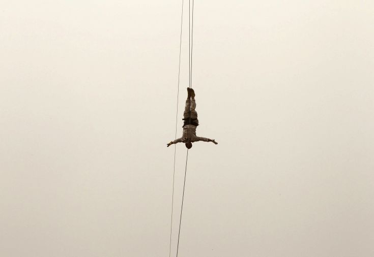 A member of the Lebanese Army's airborne regiment performs a live drill, held as part of a weapons exhibition during the Security Middle East Show in Beirut