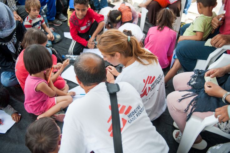 MSF psychologist Lena Zachou works together with Bashir a translator from Afghanistan at a programme set up for refugee children at the port of Mytiline. MSF psychologist Lena Zachou works together with Bashir a translator from Afghanistan at a programme set up for refugee children at the port of Mytiline.