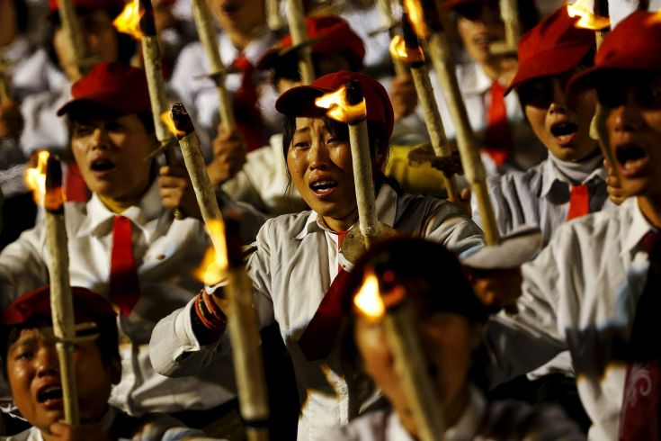 Tears run down the cheeks of a girl performer under the stands with North Korean leader Kim Jong Un during celebration of the 70th anniversary of the founding of the ruling Workers' Party of Korea, in Pyongyang October 10, 2015. Isolated North Korea marked the 70th anniversary of its ruling Workers' Party on Saturday with a massive military parade overseen by leader Kim Jong Un, who said his country was ready to fight any war waged by the United States. REUTERS/Damir Sagolj TPX IMAGES OF THE DAY Tears run down the cheeks of a girl performer under the stands with North Korean leader Kim Jong Un during celebration of the 70th anniversary of the founding of the ruling Workers' Party of Korea, in Pyongyang October 10, 2015. Isolated North Korea marked the 70th anniversary of its ruling Workers' Party on Saturday with a massive military parade overseen by leader Kim Jong Un, who said his country was ready to fight any war waged by the United States. REUTERS/Damir Sagolj TPX IMAGES OF THE DAY