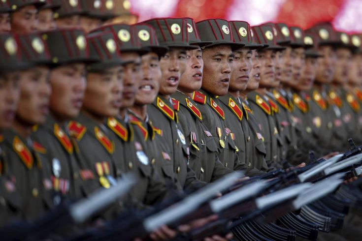 Soldiers shout slogans towards a stand with North Korean leader Kim Jong Un and other officials during the parade celebrating the 70th anniversary of the founding of the ruling Workers' Party of Korea, in Pyongyang October 10, 2015. Isolated North Korea marked the 70th anniversary of its ruling Workers' Party on Saturday with a massive military parade overseen by leader Kim Jong Un, who said his country was ready to fight any war waged by the United States. REUTERS/Damir Sagolj Soldiers shout slogans towards a stand with North Korean leader Kim Jong Un and other officials during the parade celebrating the 70th anniversary of the founding of the ruling Workers' Party of Korea, in Pyongyang October 10, 2015. Isolated North Korea marked the 70th anniversary of its ruling Workers' Party on Saturday with a massive military parade overseen by leader Kim Jong Un, who said his country was ready to fight any war waged by the United States. REUTERS/Damir Sagolj
