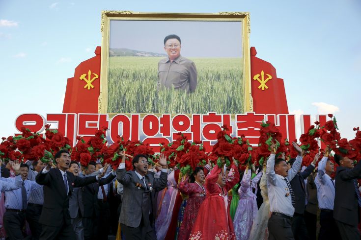 People cheer toward the stands with North Korean leader Kim Jong Un as they carry a large picture of his father and former leader Kim Jong-il during the parade celebrating the 70th anniversary of the founding of the ruling Workers' Party of Korea, in Pyongyang October 10, 2015. Isolated North Korea marked the 70th anniversary of its ruling Workers' Party on Saturday with a massive military parade overseen by leader Kim Jong Un, who said his country was ready to fight any war waged by the United States. REUTERS/Damir Sagolj People cheer toward the stands with North Korean leader Kim Jong Un as they carry a large picture of his father and former leader Kim Jong-il during the parade celebrating the 70th anniversary of the founding of the ruling Workers' Party of Korea, in Pyongyang October 10, 2015. Isolated North Korea marked the 70th anniversary of its ruling Workers' Party on Saturday with a massive military parade overseen by leader Kim Jong Un, who said his country was ready to fight any war waged by the United States. REUTERS/Damir Sagolj
