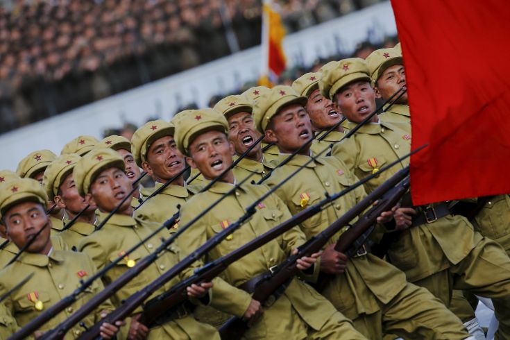 Soldiers shout slogans as they march past a stand with North Korean leader Kim Jong Un and other officials during the parade celebrating the 70th anniversary of the founding of the ruling Workers' Party of Korea, in Pyongyang October 10, 2015. Isolated North Korea marked the 70th anniversary of its ruling Workers' Party on Saturday with a massive military parade overseen by leader Kim Jong Un, who said his country was ready to fight any war waged by the United States. REUTERS/Damir Sagolj Soldiers shout slogans as they march past a stand with North Korean leader Kim Jong Un and other officials during the parade celebrating the 70th anniversary of the founding of the ruling Workers' Party of Korea, in Pyongyang October 10, 2015. Isolated North Korea marked the 70th anniversary of its ruling Workers' Party on Saturday with a massive military parade overseen by leader Kim Jong Un, who said his country was ready to fight any war waged by the United States. REUTERS/Damir Sagolj