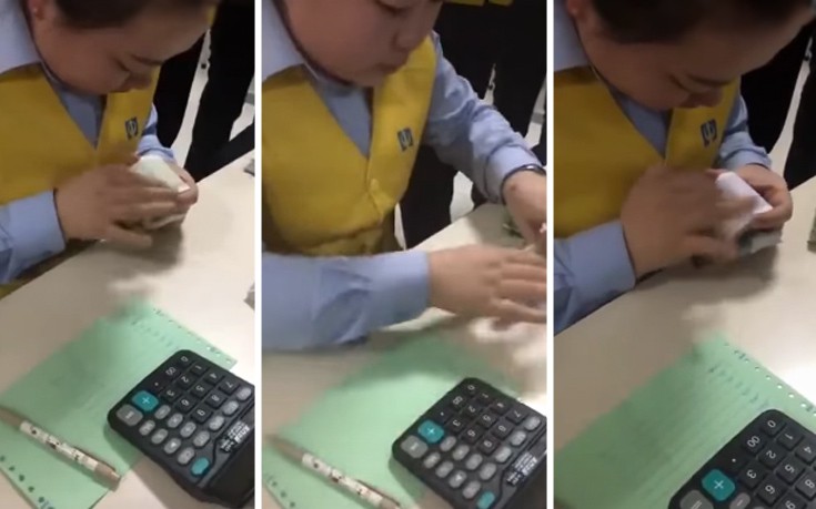 Κινέζα μετράει χαρτονομίσματα σαν αυτόματο μηχάνημα