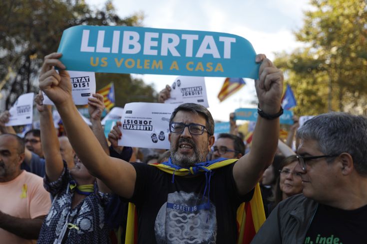 A protester holds sign reading 'Freedom. We want you home' during a march to protest against the National Court's decision to imprison civil society leaders, in Barcelona, Spain, Saturday, Oct. 21, 2017. The Spanish government moved decisively Saturday to use a previously untapped constitutional power so it can take control of Catalonia and derail the independence movement led by separatist politicians in the prosperous industrial region. AP Photo/Santi Palacios) A protester holds sign reading 'Freedom. We want you home' during a march to protest against the National Court's decision to imprison civil society leaders, in Barcelona, Spain, Saturday, Oct. 21, 2017. The Spanish government moved decisively Saturday to use a previously untapped constitutional power so it can take control of Catalonia and derail the independence movement led by separatist politicians in the prosperous industrial region. AP Photo/Santi Palacios)