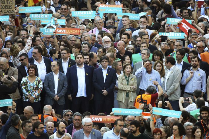 Catalan President Carles Puigdemont, second row ,center, takes part at a march to protest against the National Court's decision to imprison civil society leaders, in Barcelona, Spain, Saturday, Oct. 21, 2017. The Spanish government moved decisively Saturday to use a previously untapped constitutional power so it can take control of Catalonia and derail the independence movement led by separatist politicians in the prosperous industrial region.(AP Photo/Emilio Morenatti) Catalan President Carles Puigdemont, second row ,center, takes part at a march to protest against the National Court's decision to imprison civil society leaders, in Barcelona, Spain, Saturday, Oct. 21, 2017. The Spanish government moved decisively Saturday to use a previously untapped constitutional power so it can take control of Catalonia and derail the independence movement led by separatist politicians in the prosperous industrial region.(AP Photo/Emilio Morenatti)