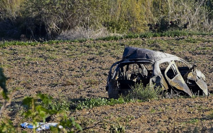 The wreckage of the car of investigative journalist Daphne Caruana Galizia lies next to a road in the town of Mosta, Malta, Monday, Oct. 16, 2017. Malta's prime minister says a car bomb has killed an investigative journalist on the island nation. Prime Minister Joseph Muscat said the bomb that killed reporter Daphne Caruana Galizia exploded Monday afternoon as she left her home in a town outside Malta's capital, Valetta. (AP Photo/Rene Rossignaud)
