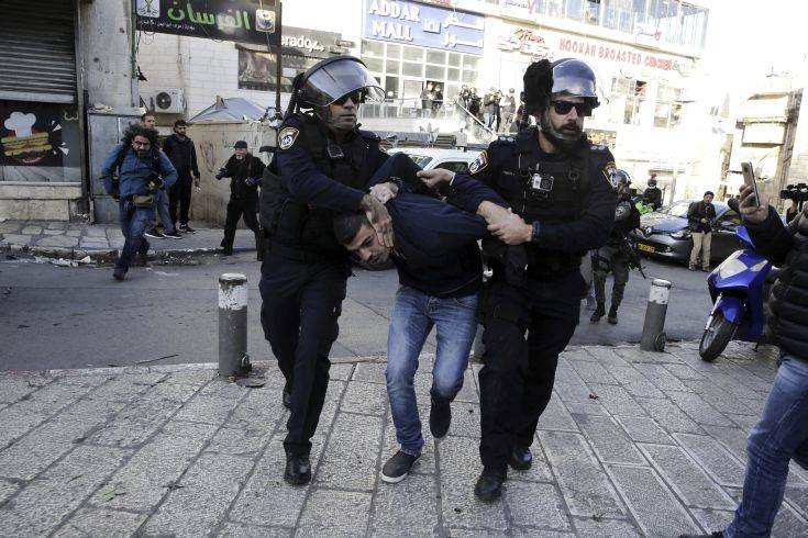 Israel police arrest a Palestinian during a protest against U.S. President Donald Trump's decision to recognize Jerusalem as the capital of Israel in Jerusalem, Saturday, Dec.9, 2017.(AP Photo/Mahmoud Illean)