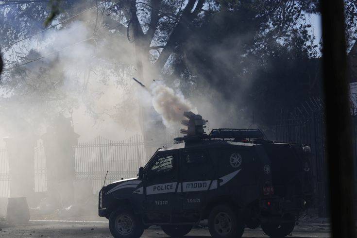 Israeli security forces shoot tears at Palestinians during a protest against U.S. President Donald Trump's decision to recognize Jerusalem as the capital of Israel in the West Bank city of Bethlehem, Saturday, Dec.9, 2017. (AP Photo/Nasser Shiyoukhi)
