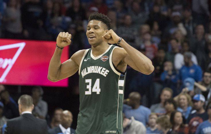 Milwaukee Bucks forward Giannis Antetokounmpo (34) celebrates after the NBA basketball game against the Oklahoma City Thunder in Oklahoma City, Friday, Dec.29, 2017. The Bucks defeated the Thunder 97-95. (AP Photo/J Pat Carter)