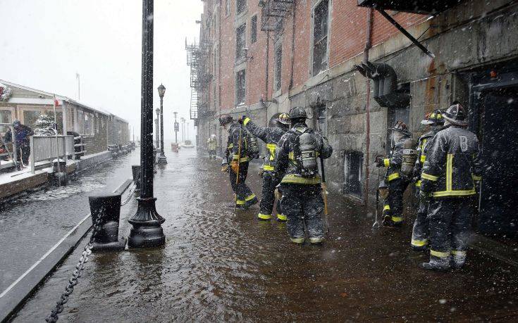 Boston firefighters work at the scene of flooding from Boston Harbor on Long Wharf in Boston, Thursday, Jan. 4, 2018. A massive winter storm swept from the Carolinas to Maine on Thursday, dumping snow along the coast and bringing strong winds that will usher in possible record-breaking cold. (AP Photo/Michael Dwyer) Boston firefighters work at the scene of flooding from Boston Harbor on Long Wharf in Boston, Thursday, Jan. 4, 2018. A massive winter storm swept from the Carolinas to Maine on Thursday, dumping snow along the coast and bringing strong winds that will usher in possible record-breaking cold. (AP Photo/Michael Dwyer)