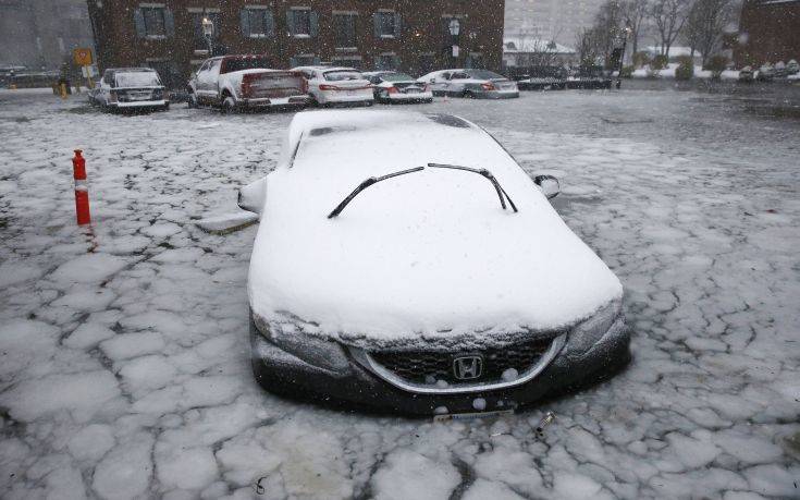 A car sits in floodwaters from Boston Harbor on Long Wharf in Boston, Thursday, Jan. 4, 2018. A massive winter storm swept from the Carolinas to Maine on Thursday, dumping snow along the coast and bringing strong winds that will usher in possible record-breaking cold. (AP Photo/Michael Dwyer) A car sits in floodwaters from Boston Harbor on Long Wharf in Boston, Thursday, Jan. 4, 2018. A massive winter storm swept from the Carolinas to Maine on Thursday, dumping snow along the coast and bringing strong winds that will usher in possible record-breaking cold. (AP Photo/Michael Dwyer)