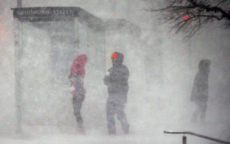 People walk in blowing snow in Boston, Thursday, Jan. 4, 2018. A massive winter storm swept from the Carolinas to Maine on Thursday, dumping snow along the coast and bringing strong winds that will usher in possible record-breaking cold. (AP Photo/Michael Dwyer) People walk in blowing snow in Boston, Thursday, Jan. 4, 2018. A massive winter storm swept from the Carolinas to Maine on Thursday, dumping snow along the coast and bringing strong winds that will usher in possible record-breaking cold. (AP Photo/Michael Dwyer)