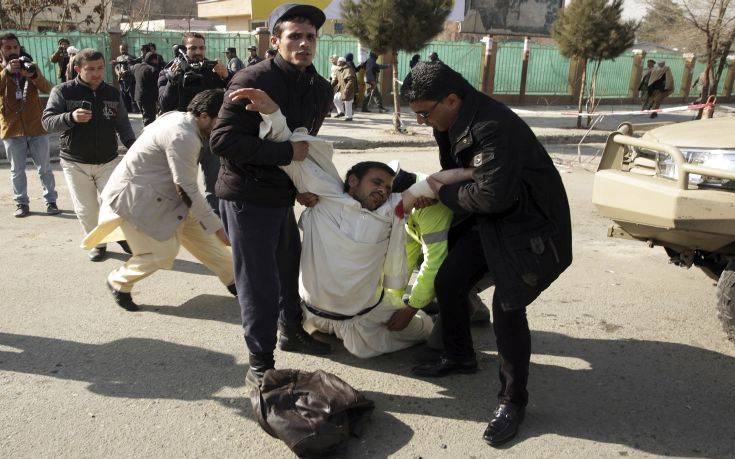 A wounded man is assisted at the site of a deadly suicide attack in the center of Kabul, Afghanistan, Saturday, Jan. 27, 2018. Afghan Public Health Ministry says dozens have been killed and over 100 wounded in suicide car bomb attack in capital Kabul. (AP Photo/Massoud Hossaini) A wounded man is assisted at the site of a deadly suicide attack in the center of Kabul, Afghanistan, Saturday, Jan. 27, 2018. Afghan Public Health Ministry says dozens have been killed and over 100 wounded in suicide car bomb attack in capital Kabul. (AP Photo/Massoud Hossaini)